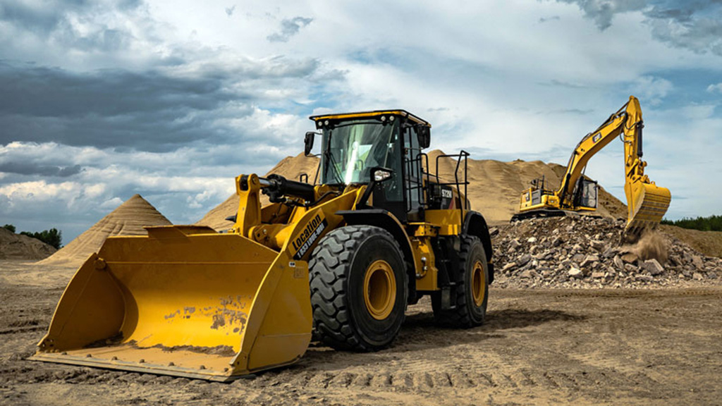 Heavy Rental photo of construction vehicles, outdoors, cloudy skies
