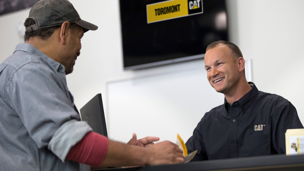 cat-dealer-network-2 Two men smiling at a toromont dealer center