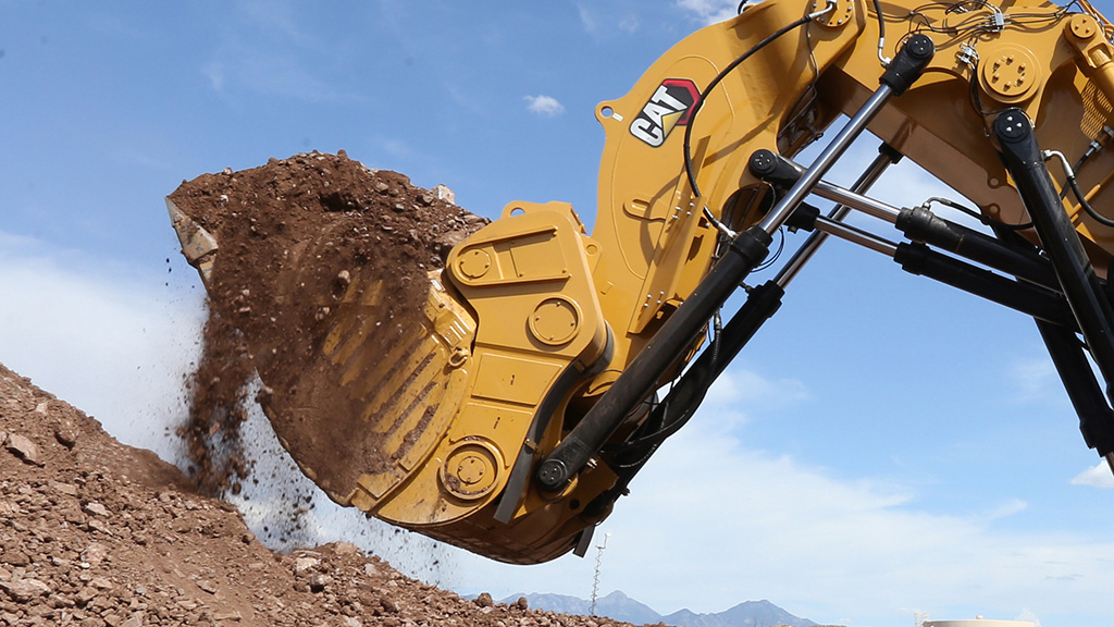 6040_00385-crop-copy2 Closeup of a bulldozer picking up dirt