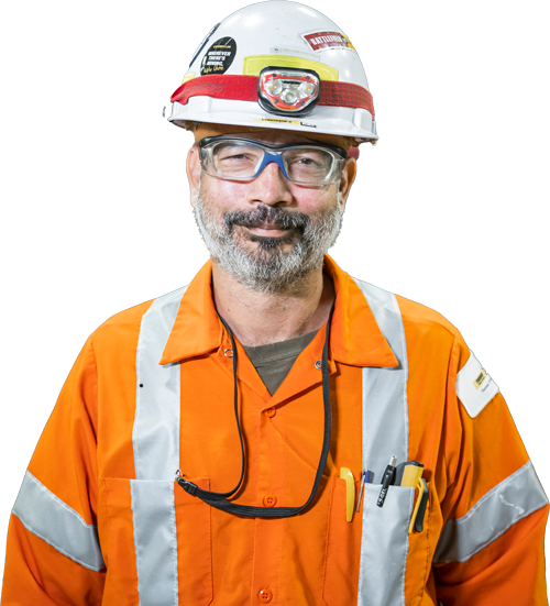 MD_Toromont_DetourLake-069_noLogo A construction worker in uniform smiling at the camera