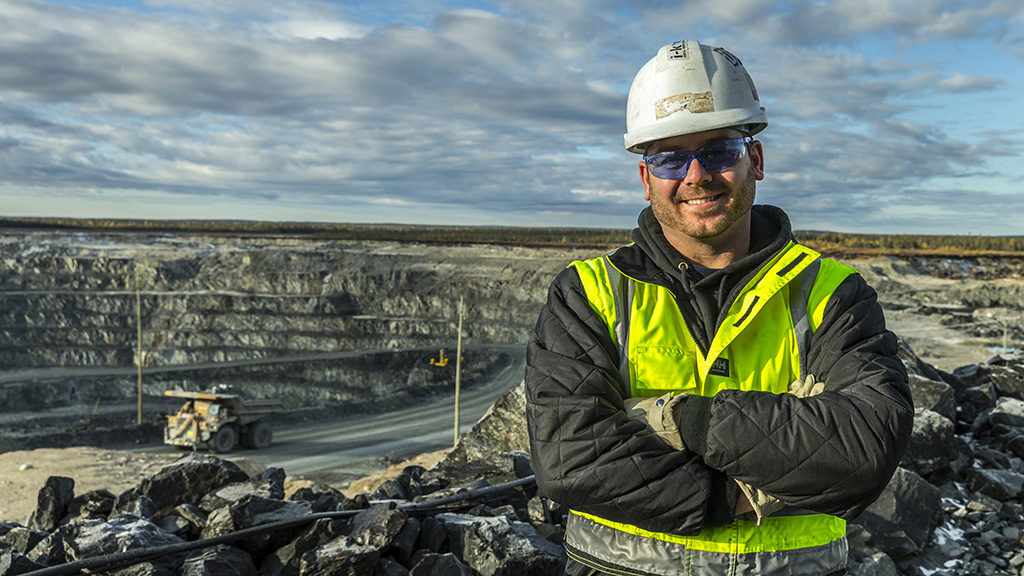 GM_Detour-Gold_15_0125-2 Construction worker smiling in front of a mining site