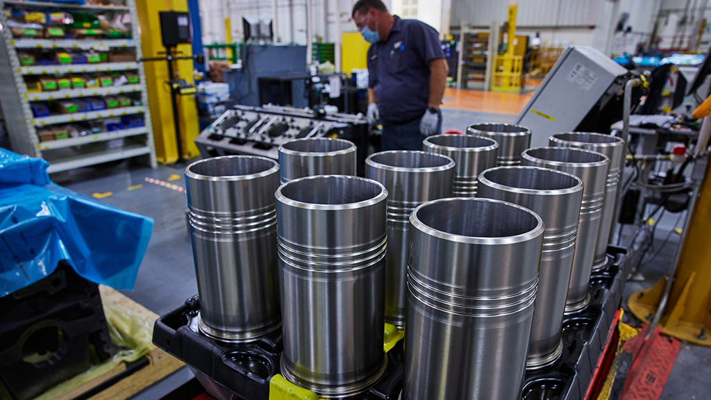 JCN12176-Cat-Reman-3500-Cylinder-Liner-(1)-copy2 Metal cylinder parts in a warehouse