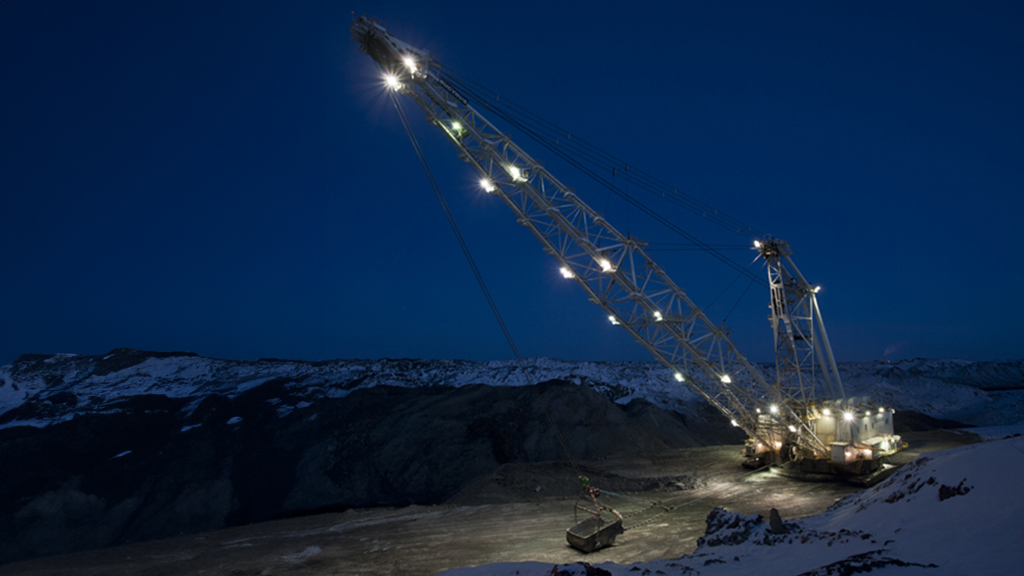 surface-equipment-draglines Crane transporting materials at night