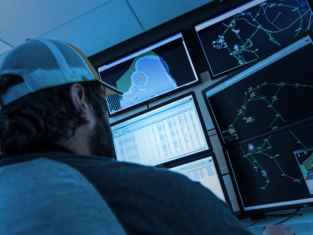 surface-technology-cta-1 worker analyzing data on screens