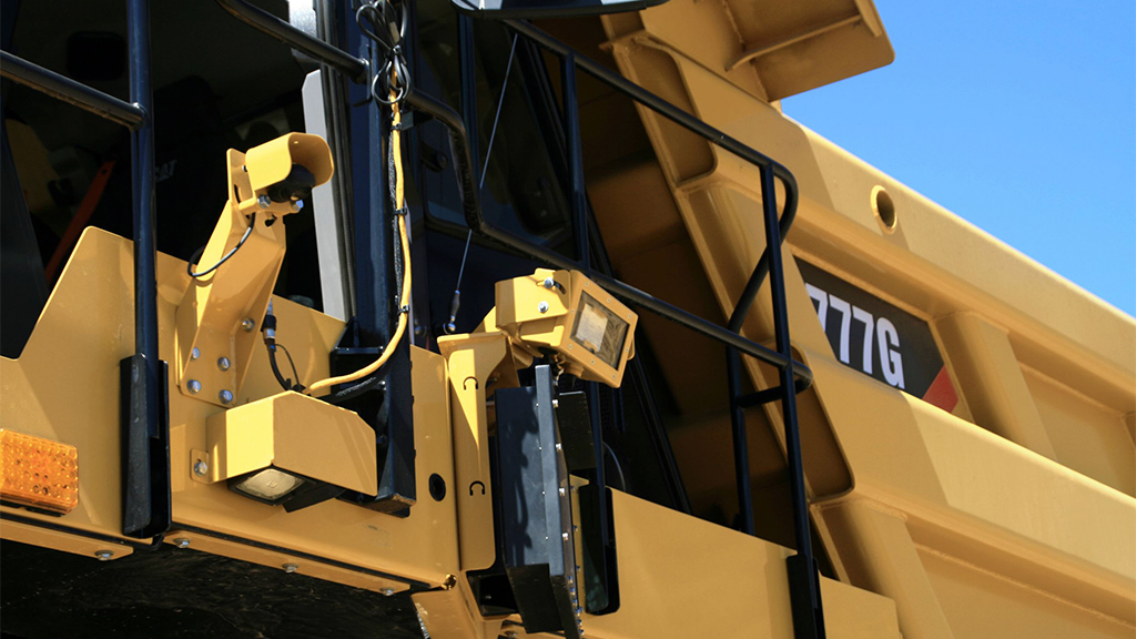 Close up of the side of a Cat machine 