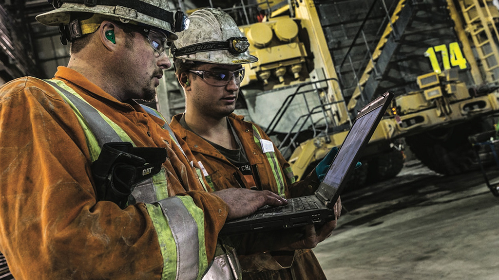 Two workers on a laptop 