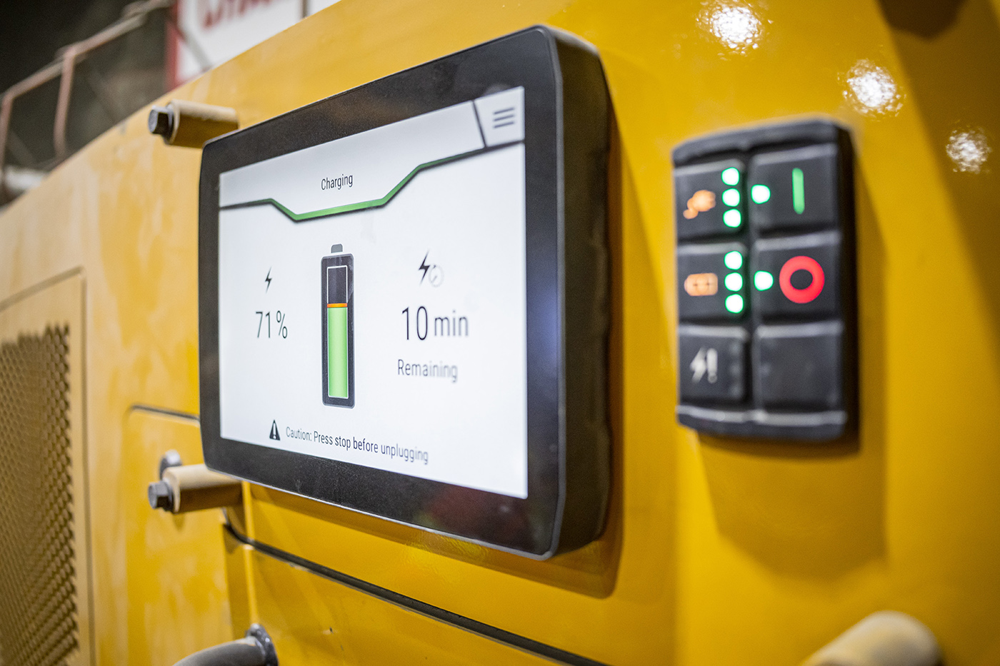 sustainabilitycommunity-electrification-hero control panel for a cat machine showing battery levels