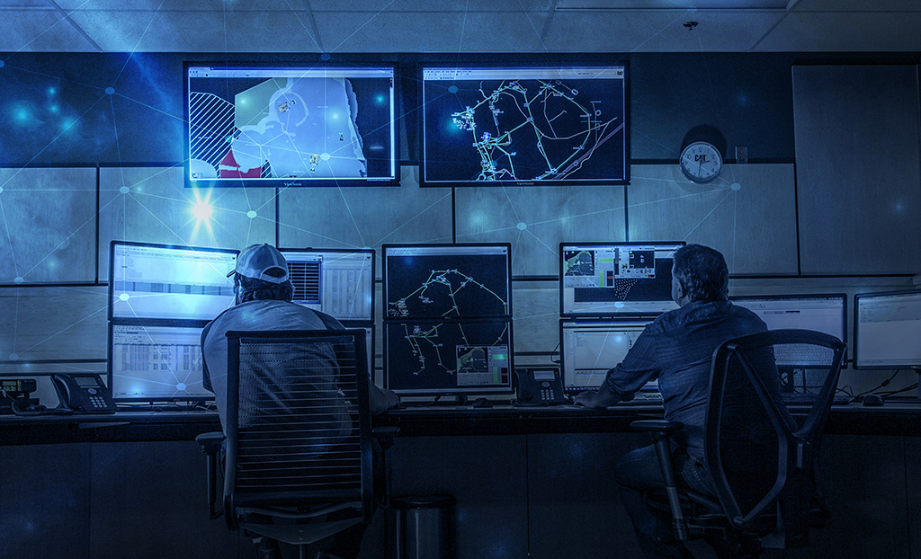 employees looking at data screens