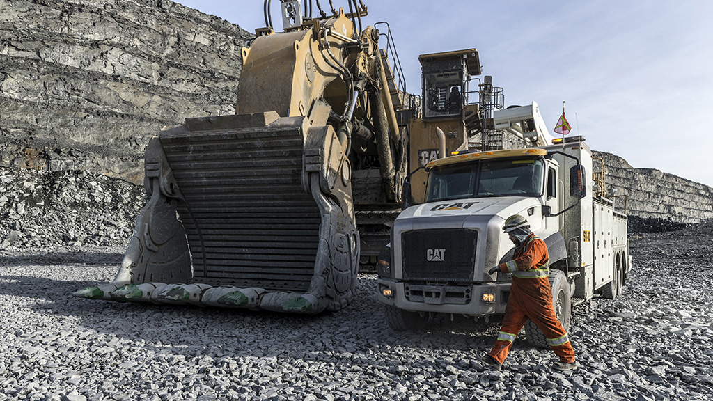 Large bulldozer and truck on construction site 