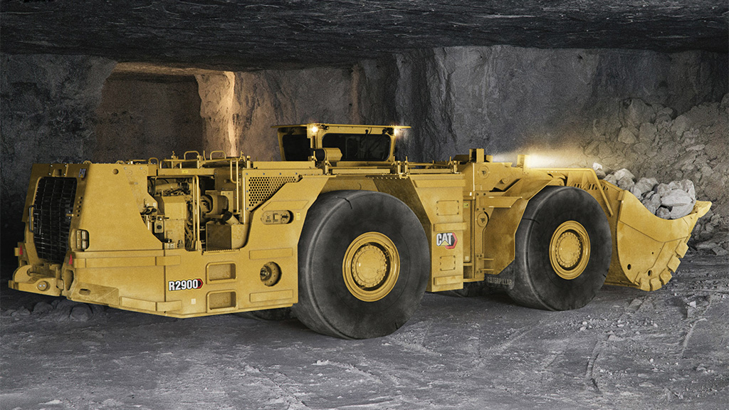 Underground bulldozer transporting rocks 