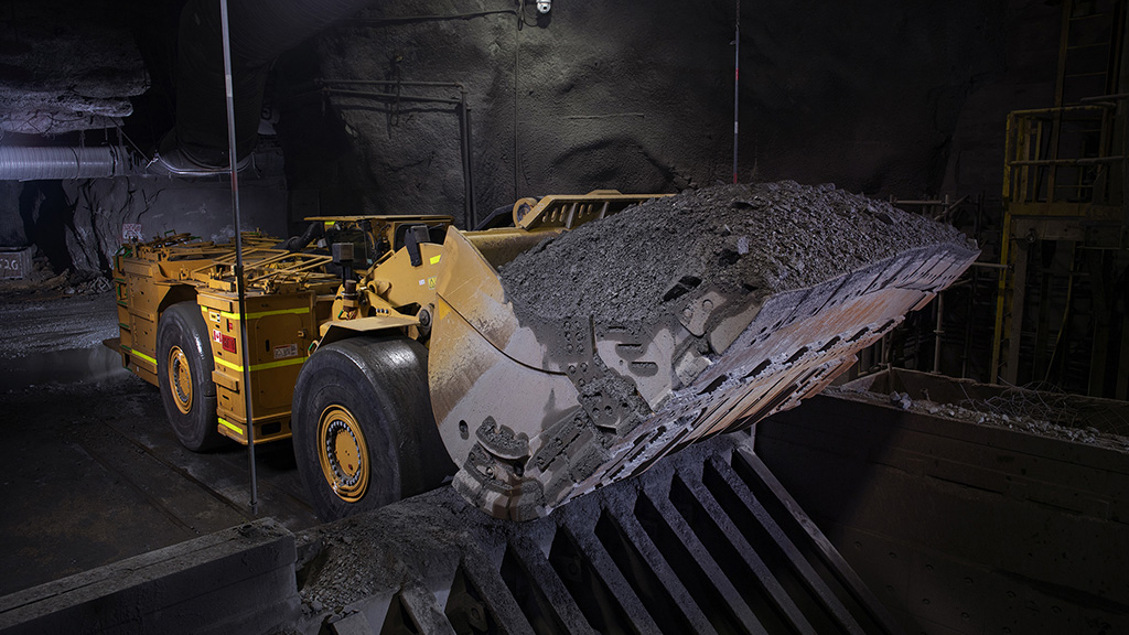 Cat underground bulldozer transporting dirt 